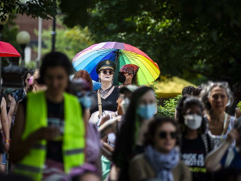  A group gathered in Minto Park on Saturday before marching onto Elgin Street for the annual Dyke March.