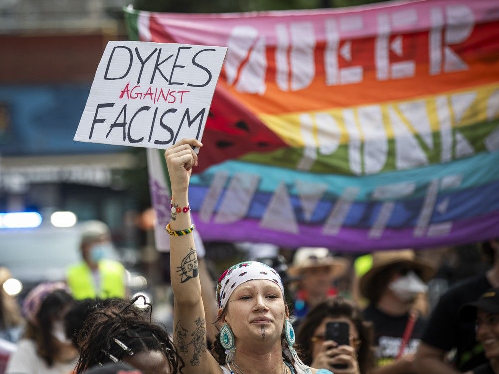  A group gathered in Minto Park on Saturday before marching onto Elgin Street for the annual Dyke March.