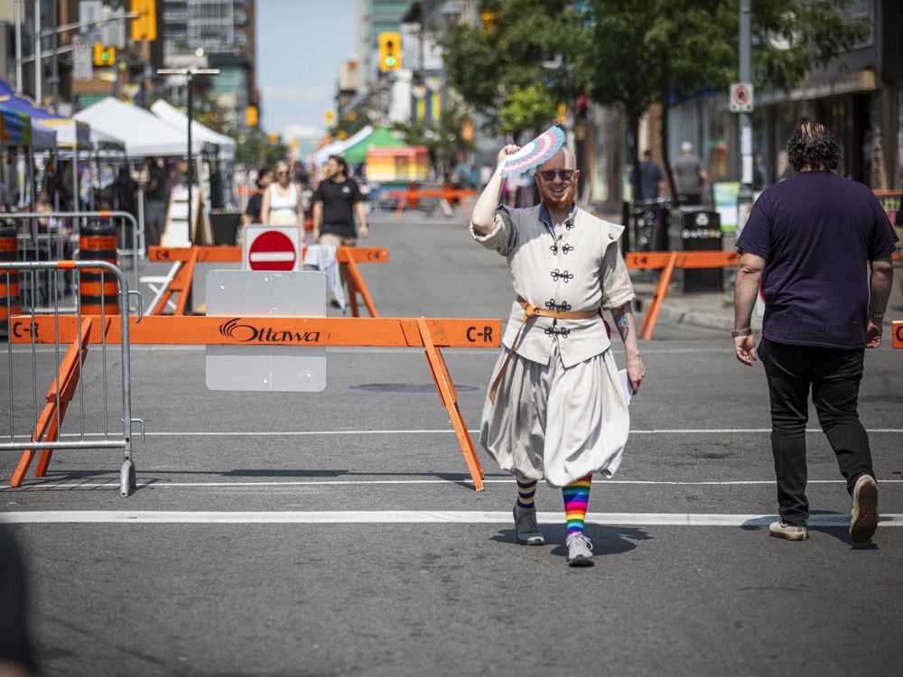  People walk down Bank Street taking in Capital Pride’s Street Festival, a celebration of 2SLGBTQIA+ communities featuring local vendors, community groups, and inclusive programming, Saturday, August 23, 2025.