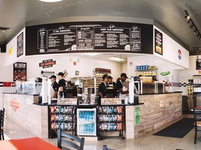 People behind a counter at a Jimmy John's