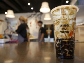 A drink with swirls of banana, milk, brown sugar