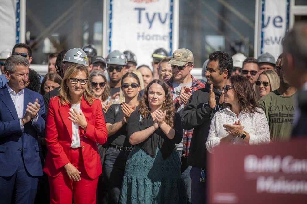  Ana Bailão, chief executive officer of Build Canada Homes, reacted as the prime minister drew attention to her new appointment during the press conference Sunday.