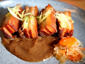 A plate of meat with sauce