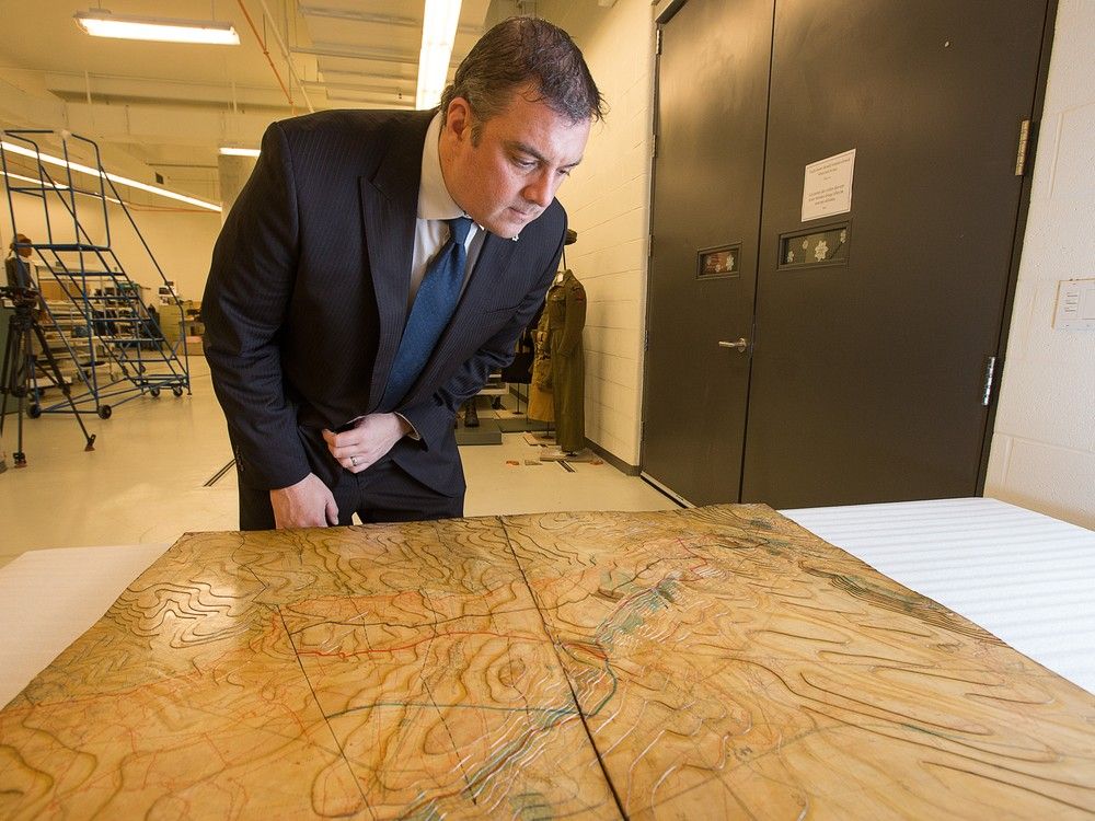 Historian Dr. Tim Cook with the Vimy Ridge wooden relief map used by Canadian commanders preparing for battle at the Canadian War Museum.  Historian Dr. Tim Cook with the Vimy Ridge wooden relief map used by Canadian commanders preparing for battle at the Canadian War Museum.