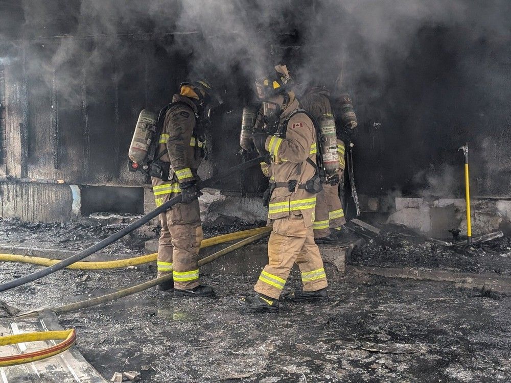 Ottawa firefighters battle the blaze Sunday morning.  Ottawa firefighters battle the blaze Sunday morning.