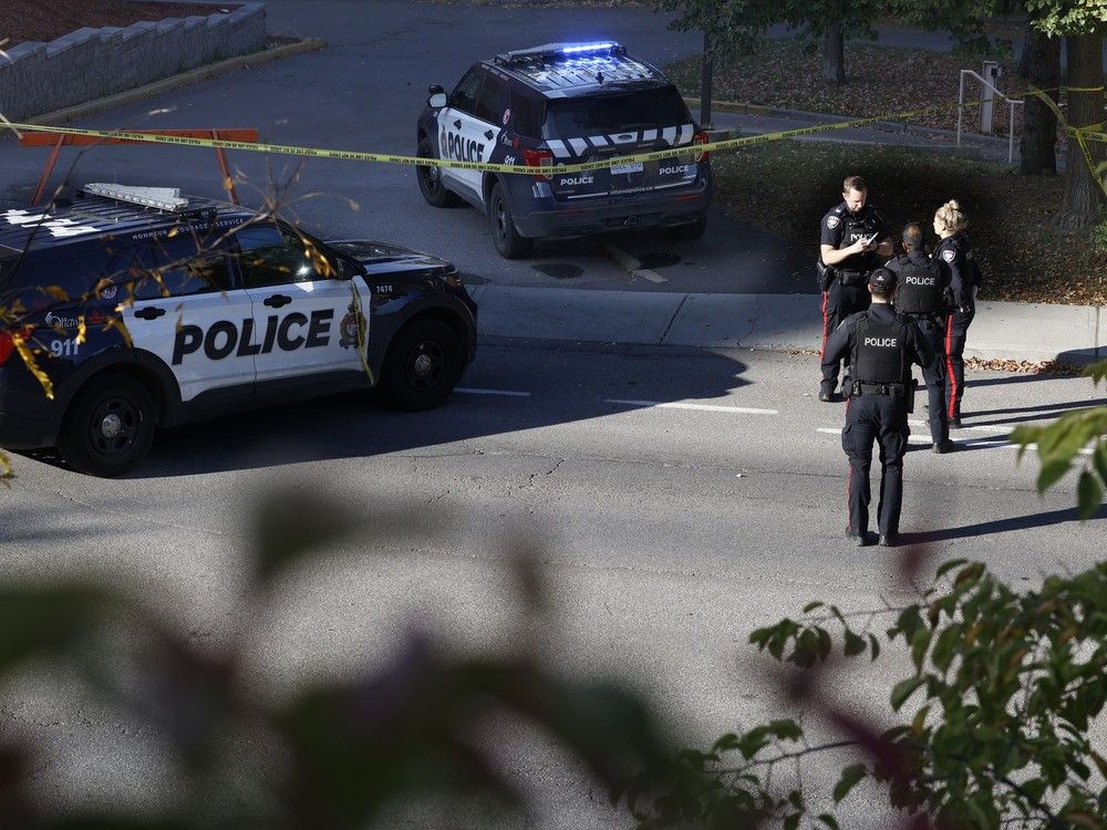 A photo taken Thursday shows police investigators at the homicide scene in the 500 block of St-Laurent Boulevard.