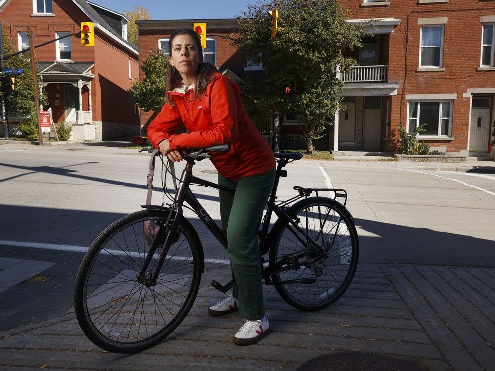  Erin Sirett poses for a photo in Centretown in Ottawa Thursday. Ottawa cyclists are concerned that the city’s proposal for new bike lanes along Gladstone and Gilmour won’t properly protect people on their bikes.