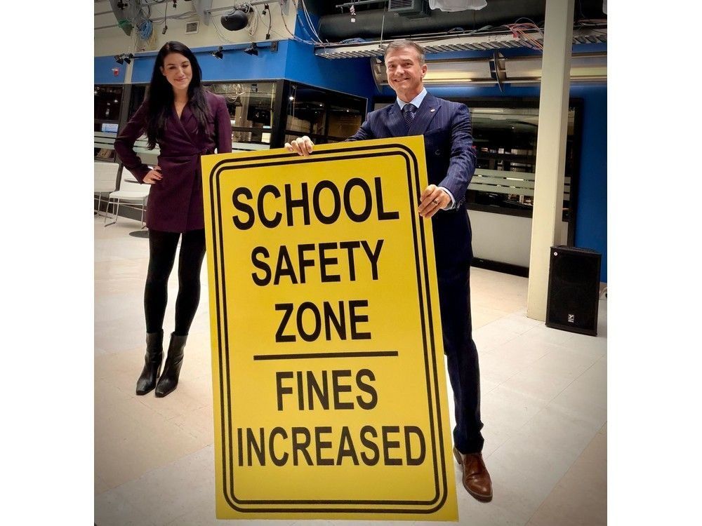 Beacon Hill-Cyrville Coun. Tim Tierney poses with one of the early concept school safety zone signs sent by the provincial government. According to Tierney, the new temporary school-zone signs that have been shipped to Ottawa are 12-foot-tall “highway-sized, giant signs”. Beacon Hill-Cyrville Coun. Tim Tierney poses with one of the early concept school safety zone signs sent by the provincial government. According to Tierney, the new temporary school-zone signs that have been shipped to Ottawa are 12-foot-tall “highway-sized, giant signs”.