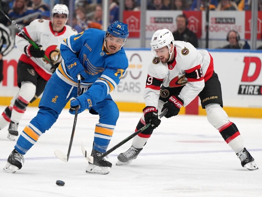  the blues’ mathieu joseph passes the puck against defensive pressure by the senators’ drake batherson in the second period.