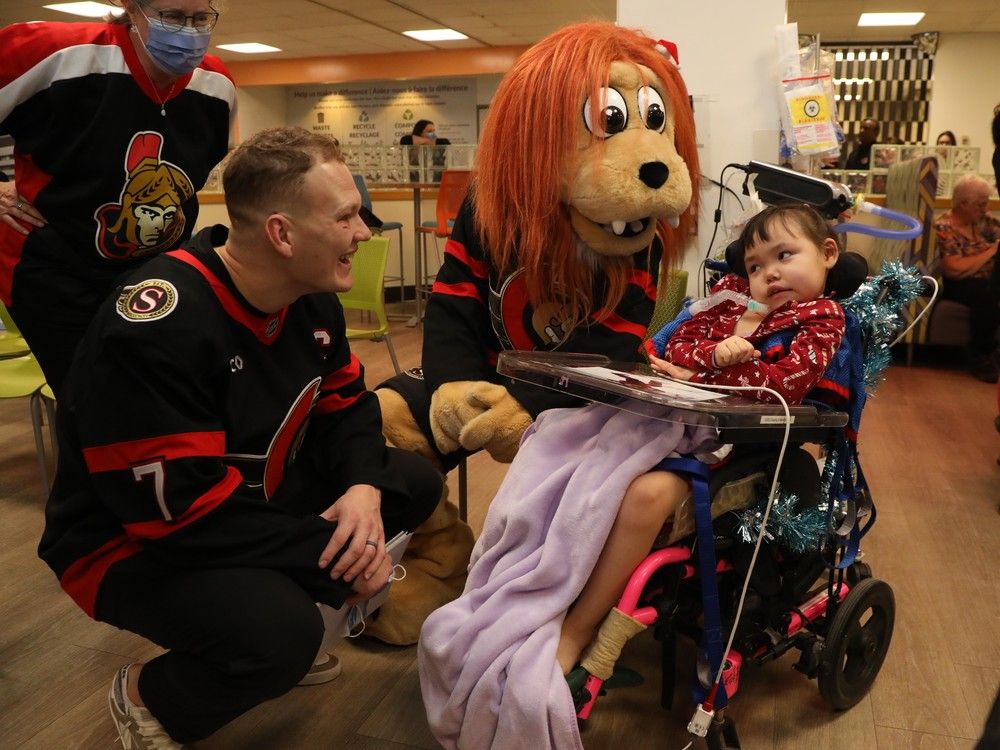 Brady Tkachuk of the Ottawa Senators shares a laugh with Spartacat and 7-year-old Alashua. Brady Tkachuk of the Ottawa Senators shares a laugh with Spartacat and 7-year-old Alashua.