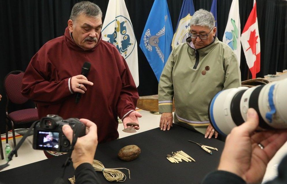  Darrel Nasogaluak, elder and chair of Tuktoyaktuk Community Corporation, holds an ulu knife that was repatriated from the Vatican as Paul Irngaut, acting president of Nunavut Tunngavik Inc., looks on during a press conference held at the Canadian Museum of History, Dec. 9, 2025.