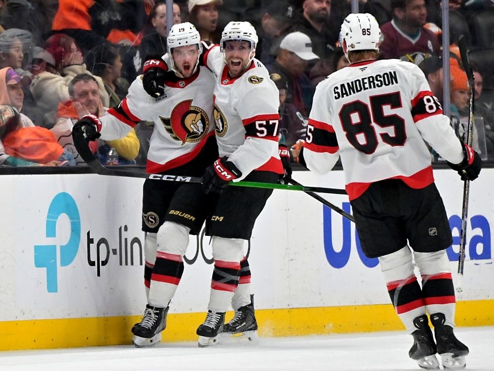 from left, ottawa senators’ drake batherson, david perron and jake sanderson celebrate after scoring the winning goal against the anaheim ducks last month.
