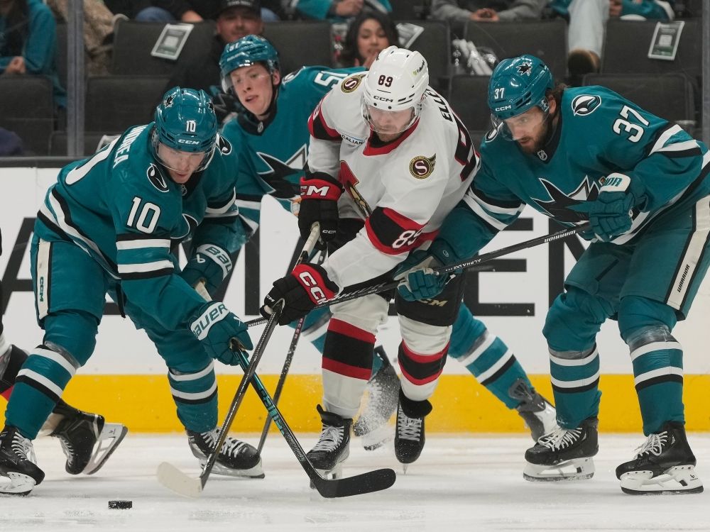 ottawa senators centre lars eller reaches for the puck between san jose sharks’ ty dellandrea (10) and timothy liljegren during a game last month.