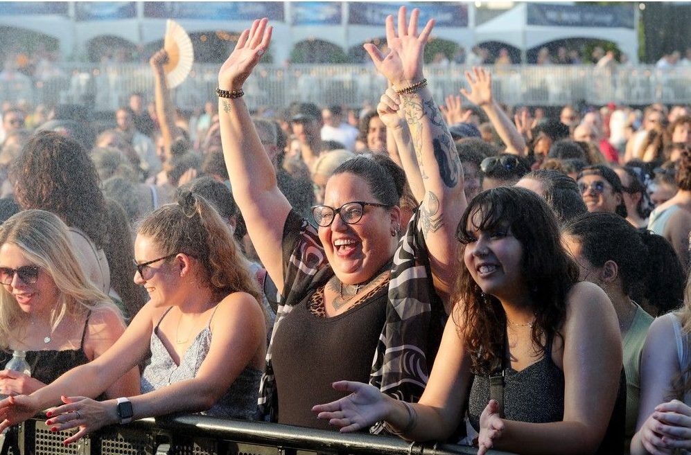 JULY 11, 2025 -- Security sprayed cold water on fans at the mainstage to cool them down as the heat and humidity made things very hot and sticky on day two of Bluesfest.