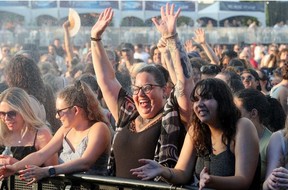 JULY 11, 2025 -- Security sprayed cold water on fans at the mainstage to cool them down as the heat and humidity made things very hot and sticky on day two of Bluesfest.