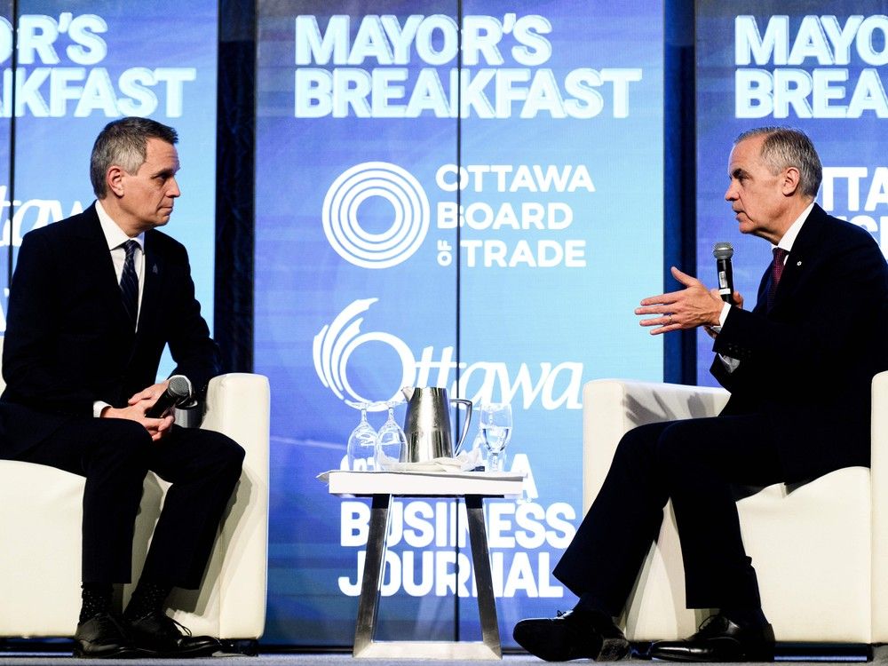 Prime Minister Mark Carney, right, and Ottawa Mayor Mark Sutcliffe take part in a fireside chat during the Ottawa Board of Trade Mayor's Breakfast Series in Ottawa, on Monday, Dec. 8, 2025.