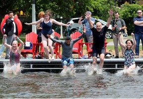 JUNE 12, 2025 -- National Capital Commission CEO Tobi Nussbaum (second from right) was joined by local MP Yasir Naqvi (centre) and former MP Catherine McKenna (left) and others for a splashy opening of swimming season at the brand new Dow's Lake Dock.