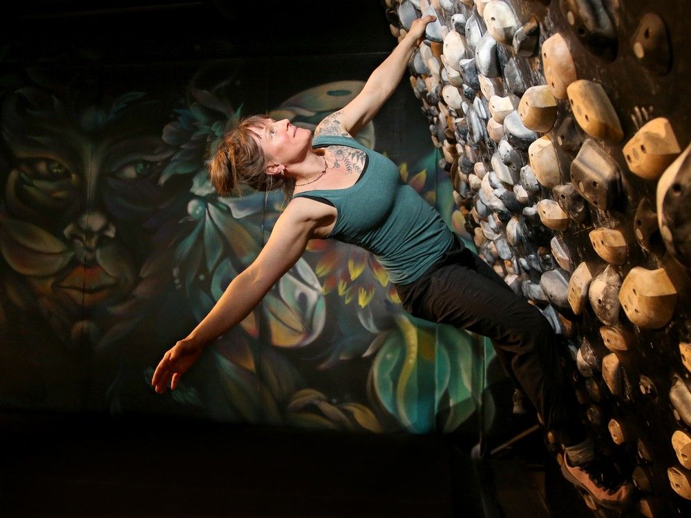 NOV. 25, 2025 -- Co-owner Jazmine Maisonneuve tackles one of the tension walls upstairs, which actually tilts to challenge the difficulty level of the climber.