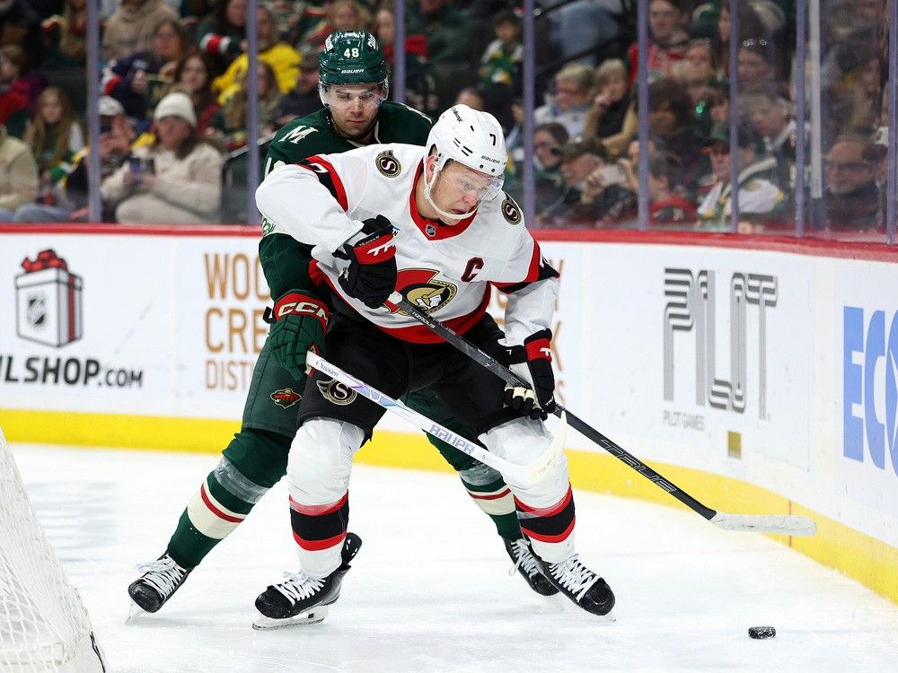  brady tkachuk of the senators skates with the puck against daemon hunt of the wild in the second period on saturday.