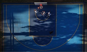 OTTAWA - Oct 14, 2025 -- Three friends enjoy some basketball in downtown Ottawa.