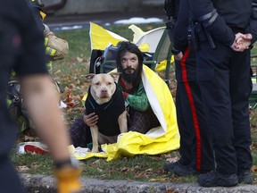 OTTAWA - Nov 13, 2025 -- Ottawa Police, Paramedics and Ottawa Fire attend to two people and a dog who were in a house fire on Weston Street.