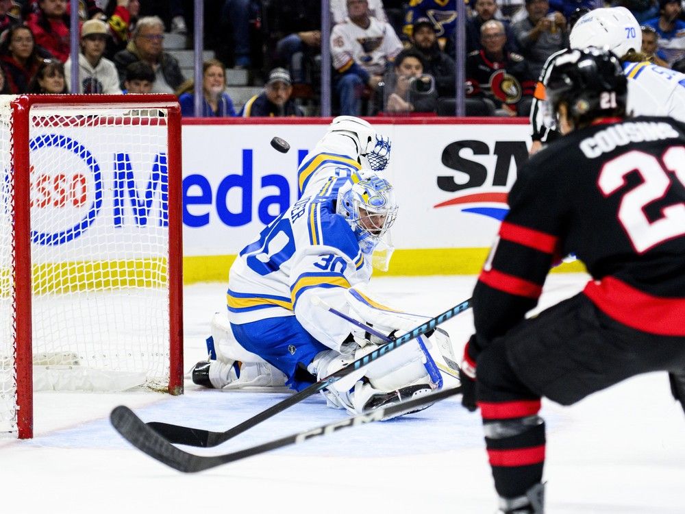 st. louis blues goaltender joel hofer makes a save during the second period against the ottawa senators in ottawa on saturday, dec. 6, 2025.