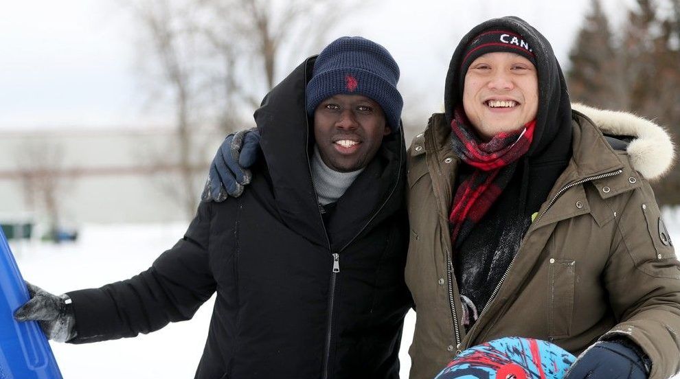  New friends Dave Nguyen and Chance Niyromugabo (right) pose at the Charlie Rogers Place hill in Kanata.