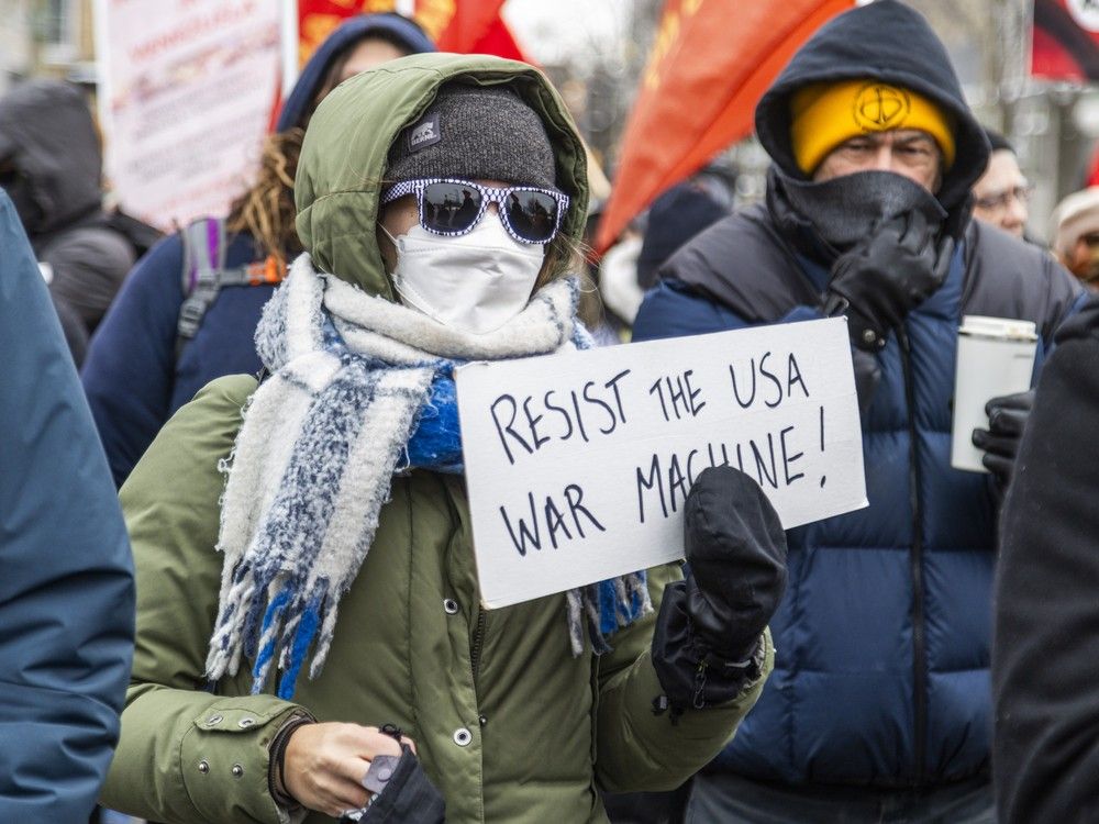  Protesters gathered and marched outside the U.S. Embassy in Ottawa on Sunday, Jan. 4, 2026, citing opposition to a reported U.S. incursion into Venezuela.