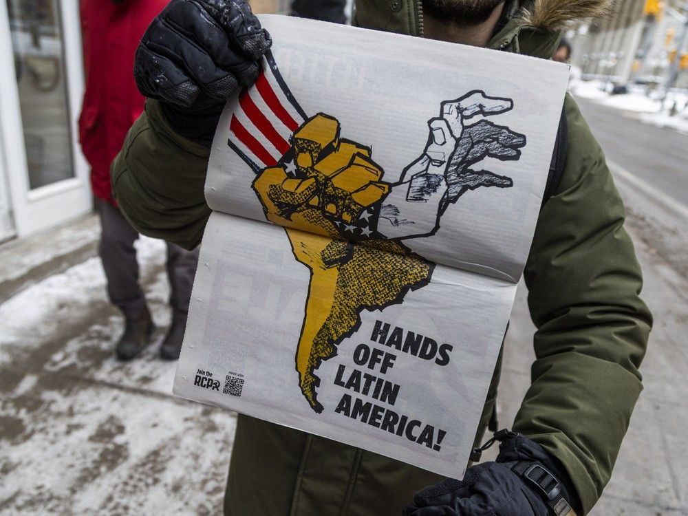  Protesters gathered and marched outside the U.S. Embassy in Ottawa on Sunday, Jan. 4, 2026, citing opposition to a reported U.S. incursion into Venezuela.