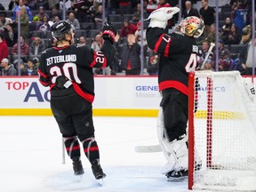 Fabian Zetterlund and goalie James Reimer of the Ottawa Senators celebrate after a 5-2 win against the Colorado Avalanche.