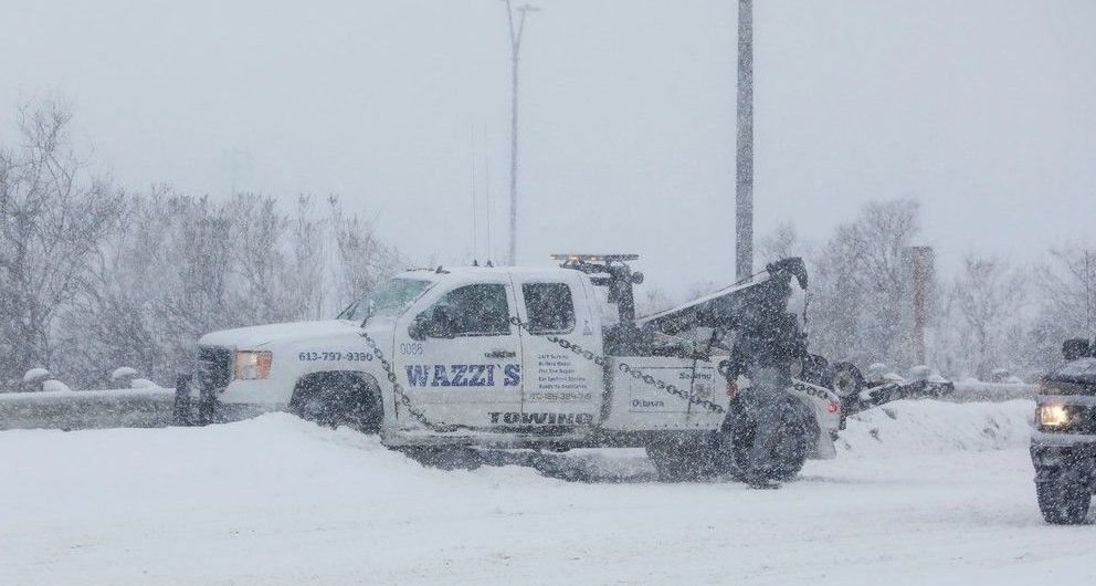  A tow truck stuck in a snowbank on Greenbank Road during Thursday’s storm.