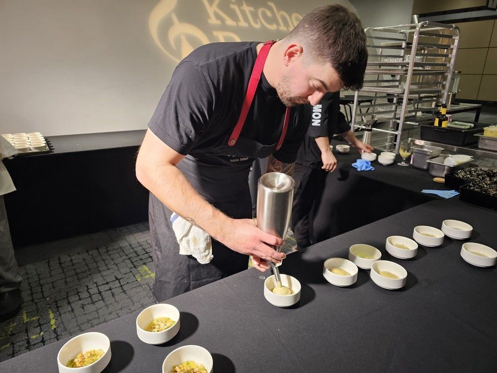  Montreal chef Isa&euml;l Gadoua of Restaurant Chez Jean-Paul adds poireaux vinaigrette to his French fry panna cotta at the Canadian Culinary Championship 2026.