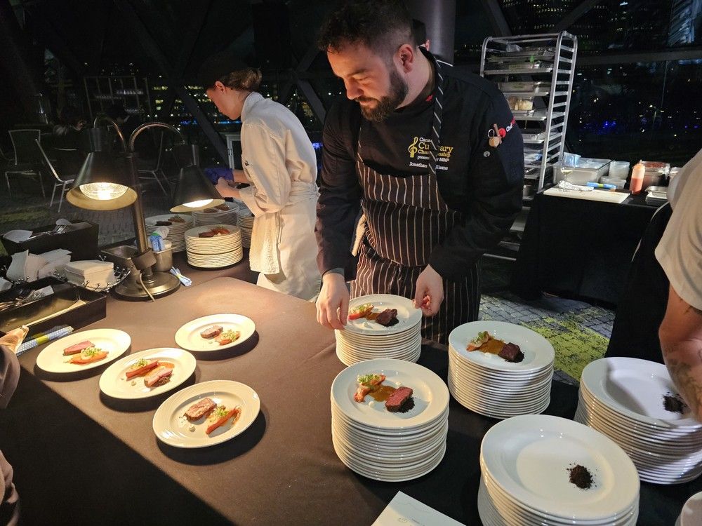  Chef Jonathan Williams of the Park Hyatt Toronto prepares beef Short Rib Pastrami, &ldquo;a very good carrot,&rdquo; rye crumble and horseradish cream at the Canadian Culinary Championship 2026.
