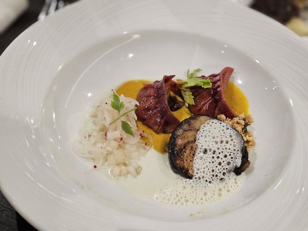  The Winnipeg dish at the Canadian Culinary Championship: smoked duck and squash dumplings on Massaman curry sauce, black pepper glazed octopus and fermented kohlrabi slaw, topped with toasted peanut and puffed wild rice.