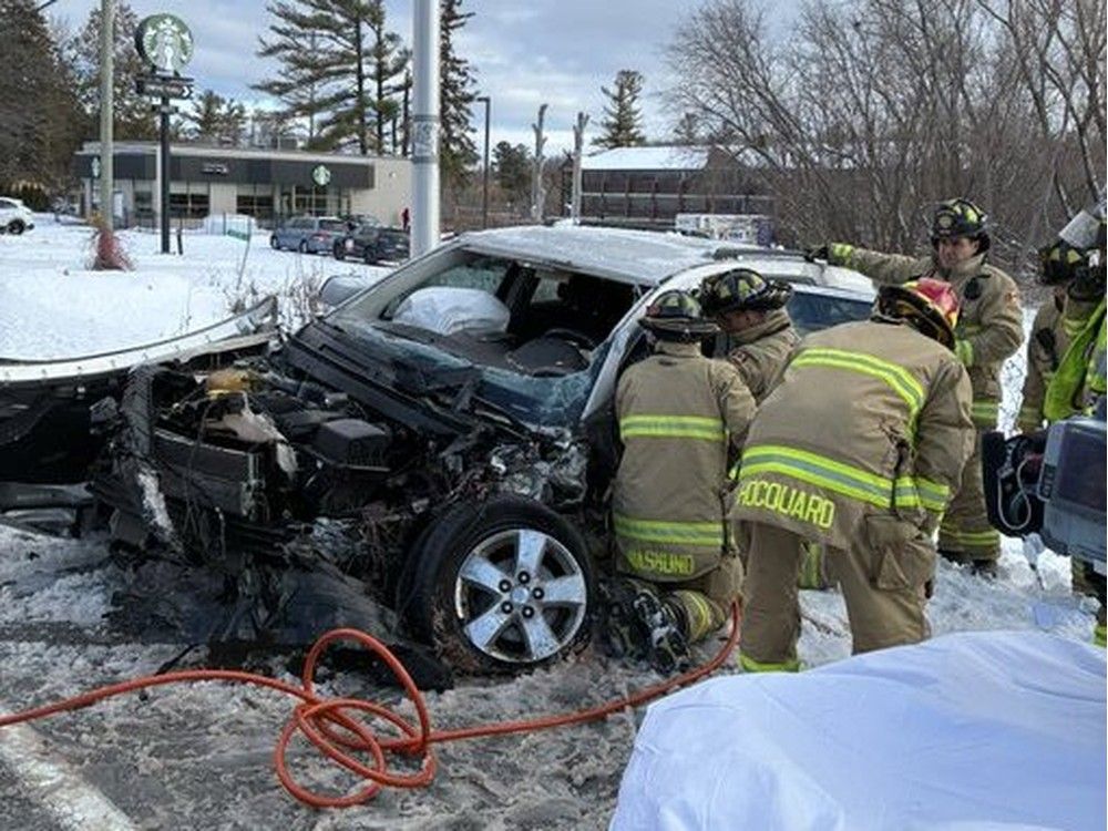  Firefighters work to extricate driver trapped in a head-on crash Sunday, Jan. 11, 2026
