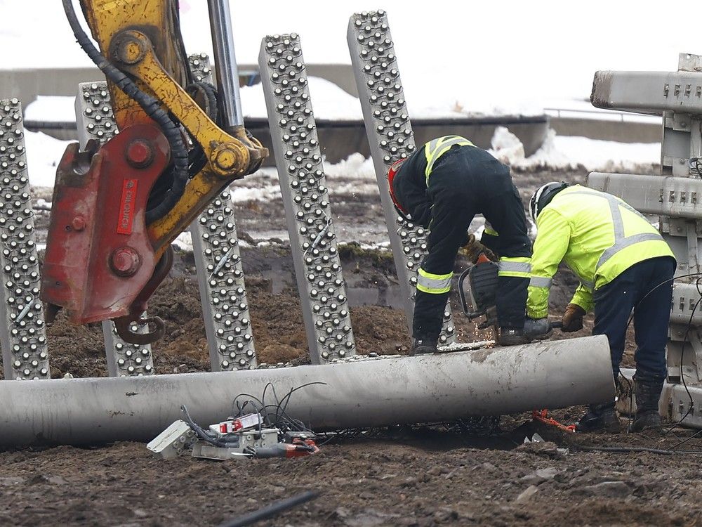 Crews take down the Moving Surfaces lighted sculpture at Lansdowne Park in Ottawa on Wednesday.