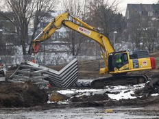 Crews take down the Moving Surfaces lighted sculpture at Lansdowne Park in Ottawa Wednesday.