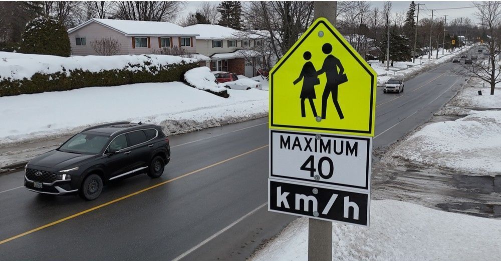  School signs on Bearbrook Road, north of Innes in Blackburn Hamlet. Larger school zone signs have replaced a speed camera in the area.