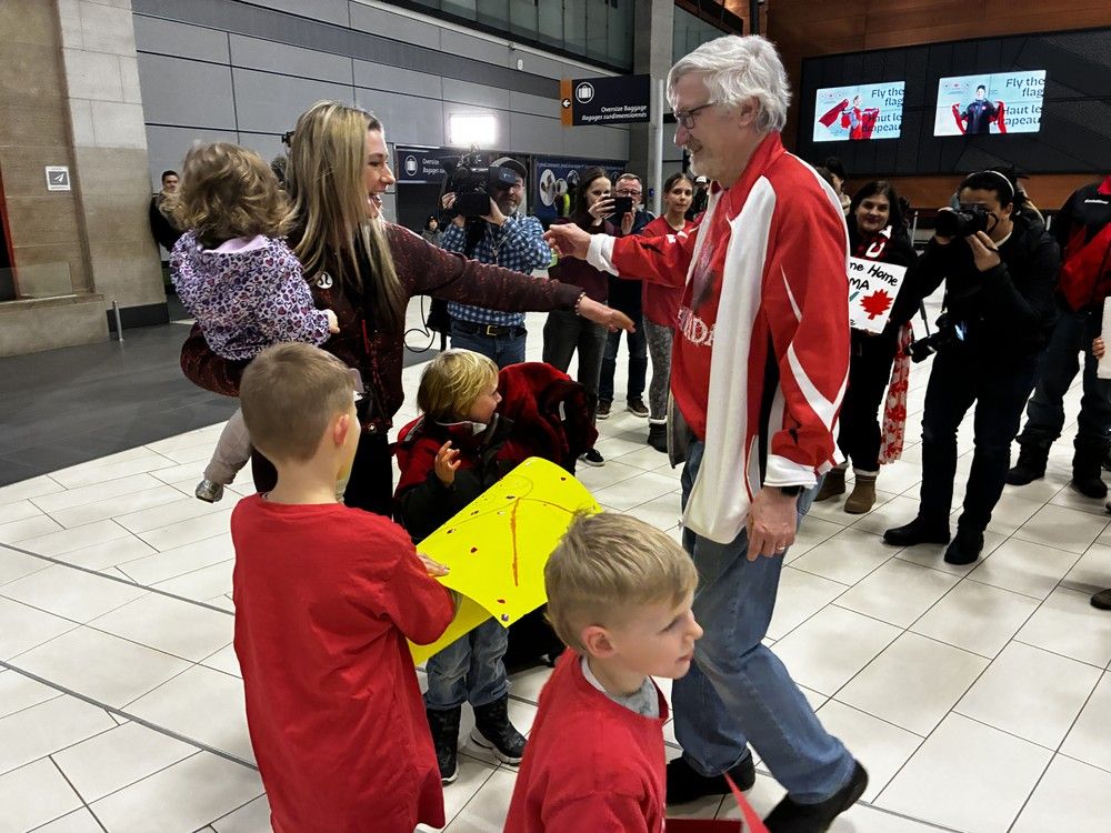  Bronze-medallist curler Emma Miskew is greeted by her father, Art Miskew, upon her return from the Milano-Cortina Winter Olympics.