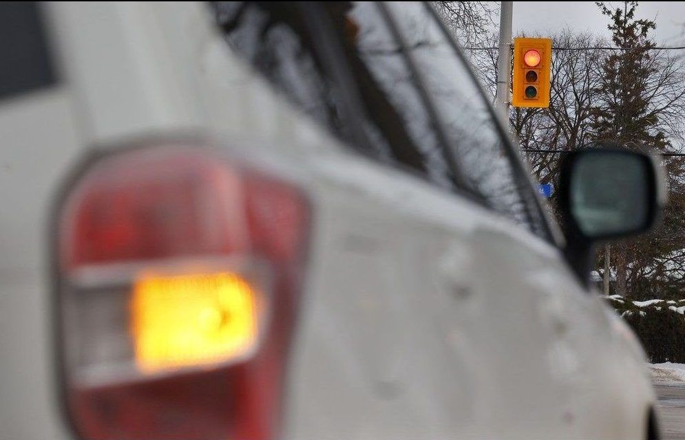  A car turns right during a red light at an Ottawa intersection on Wednesday.