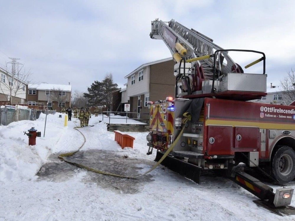  Ottawa Fire Services extinguish a blaze at a two-storey, middle-unit townhome in the 1200 block of Ledbury Avenue.