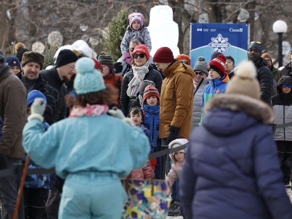 Families line up to see some ice sculptures while enjoying the last day of Winterlude at Confederation Park on Monday. Families line up to see some ice sculptures while enjoying the last day of Winterlude at Confederation Park on Monday.