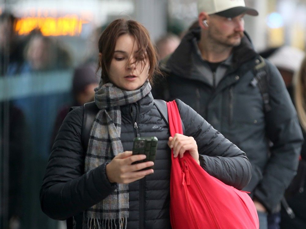  A November 2025 file photo of commuters at the Tunney&rsquo;s Pasture LRT station, where many public servants travel during rush hour.