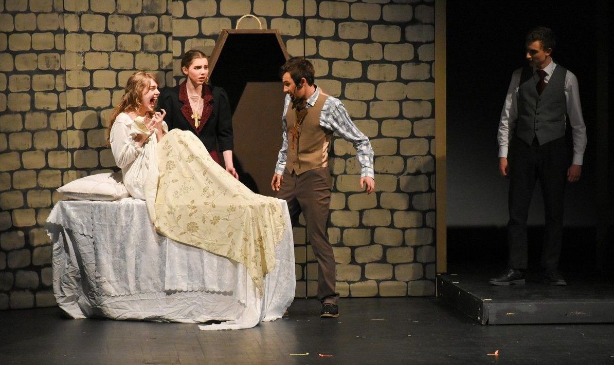 Lucy played by Brianna Brooks (L), Mina played by Emily Farley Ratcliffe (2ndFL), Dr. Van Helsing played by Gabriel Maloney (M), and Jonathan played by Spencer Pullin (R) during Hillcrest High School's Cappies production of Dracula, held on March 12, 2026.