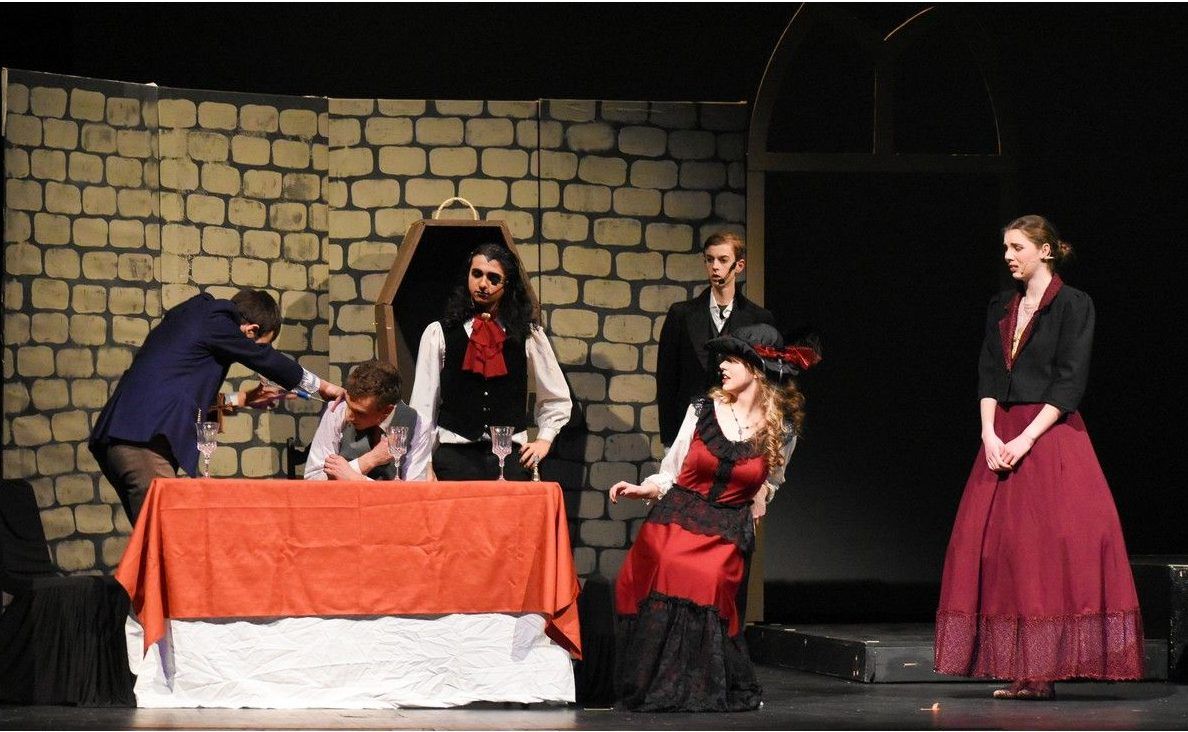 Dr. Van Helsing played by Gabriel Maloney (L), Jonathan played by Spencer Pullin (2ndFL), Dracula played by Mohamed Zreik (3rdFL), Lucy played by Brianna Brooks (M), Butler played by Nigel Thomas-Harvey (R), and Mina played by Emily Farley Ratcliffe (2ndFR) during Hillcrest High School's Cappies production of Dracula, held on March 12, 2026 at Hillcrest High School
