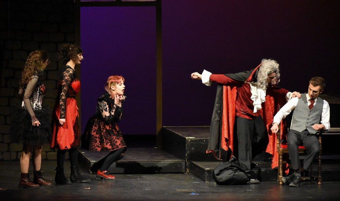 Dracula's Brides played by Melody Babin (L), Madeline MacKinnon (2ndFL), Eliza Robertson (M), Dracula played by Mohamed Zreik (R), and Jonathan played by Spencer Pullin (2ndFR) during Hillcrest High School's Cappies production of Dracula, held on March 12, 2026.
