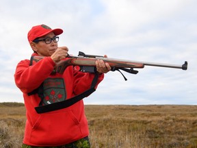 A Canadian Ranger handles the military's new C-19 rifle. Shortly after the rifles were sent to Ranger units, red dye from the stocks started appearing on the hands of the soldiers when the weapons were exposed to wet conditions.
