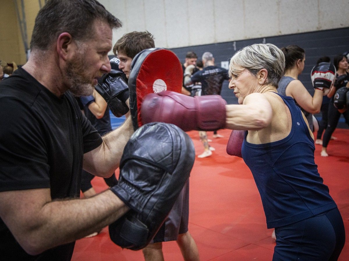  Carolle Laliberté fires off punches during a drill as part of the Kick It for Parkinson event on Saturday.