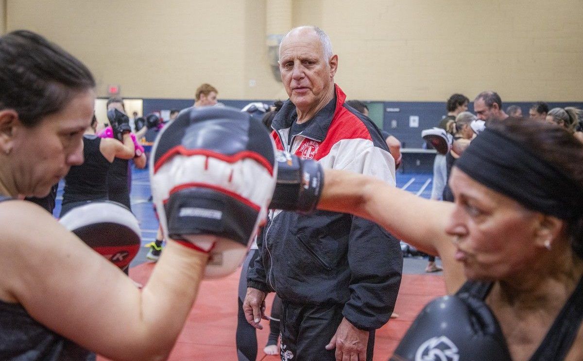 Jean-Yves “The Iceman” Theriault, a former world kickboxing champion, moves through the space offering guidance and encouragement to participants during sessions at the Kick It for Parkinson’s fundraiser.