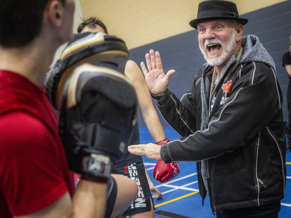  Chantal Theriault’s uncle, Vic Theriault, smiles as he helps participants during the Kick It for Parkinson’s fundraiser.